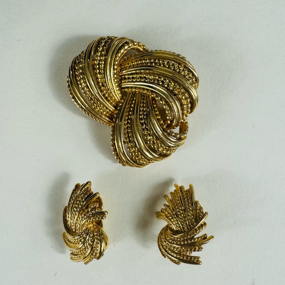 Signed and numbered Boucher Knot Brooch and coordinated Monet clip on earrings